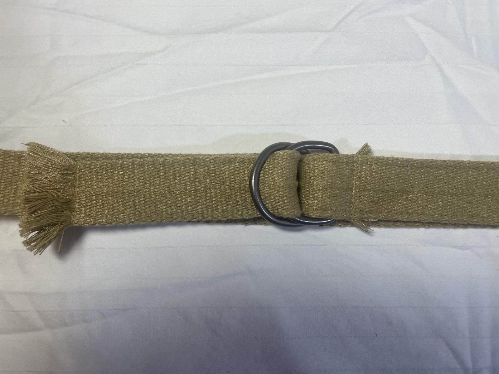 unbranded khaki/tan canvas military-style D-ring web belt
