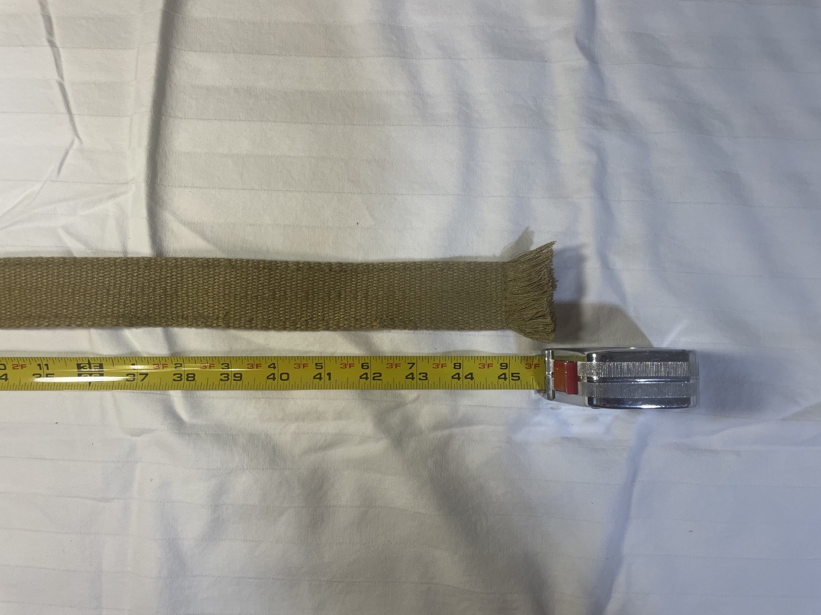 unbranded khaki/tan canvas military-style D-ring web belt