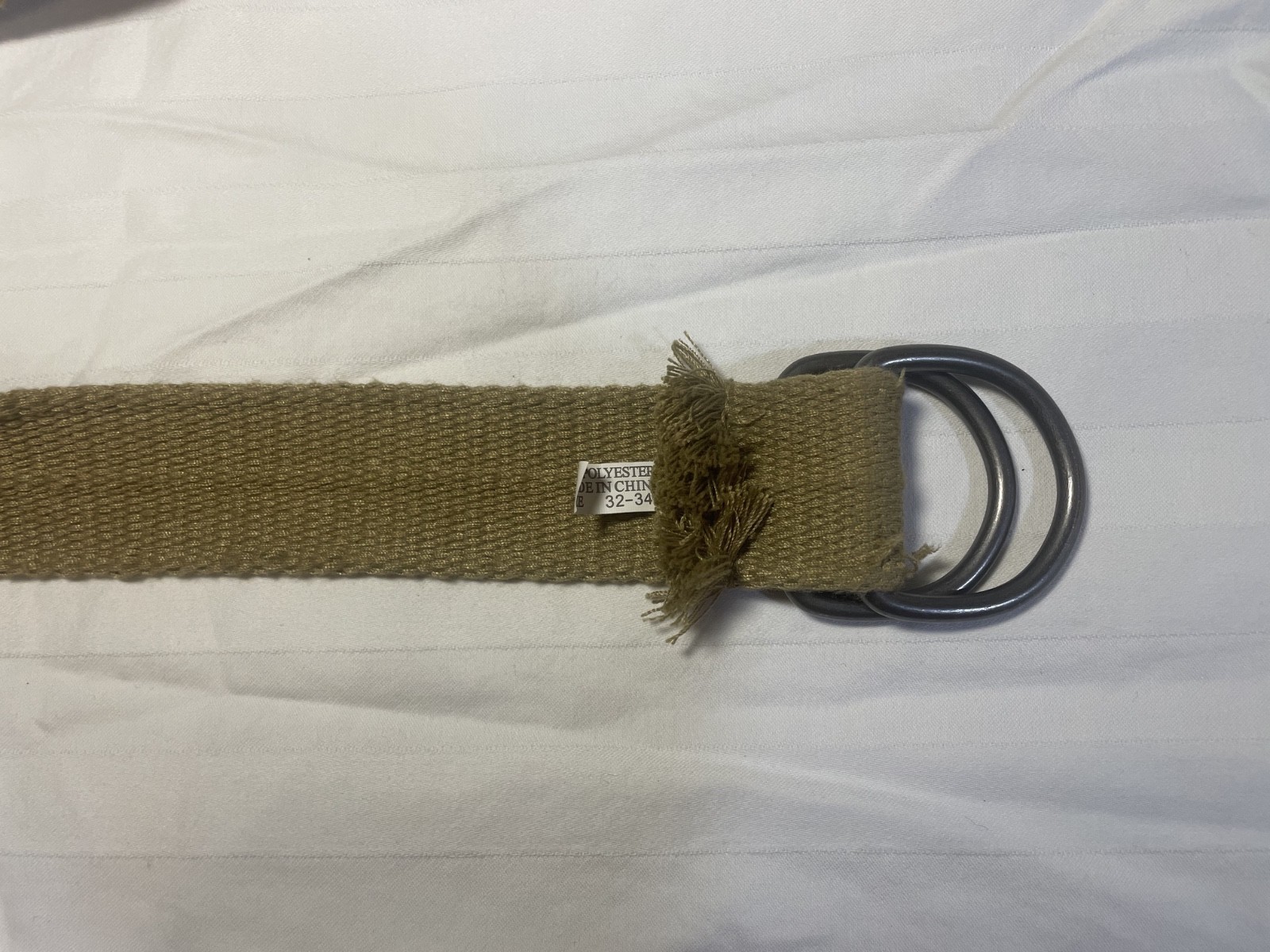 unbranded khaki/tan canvas military-style D-ring web belt