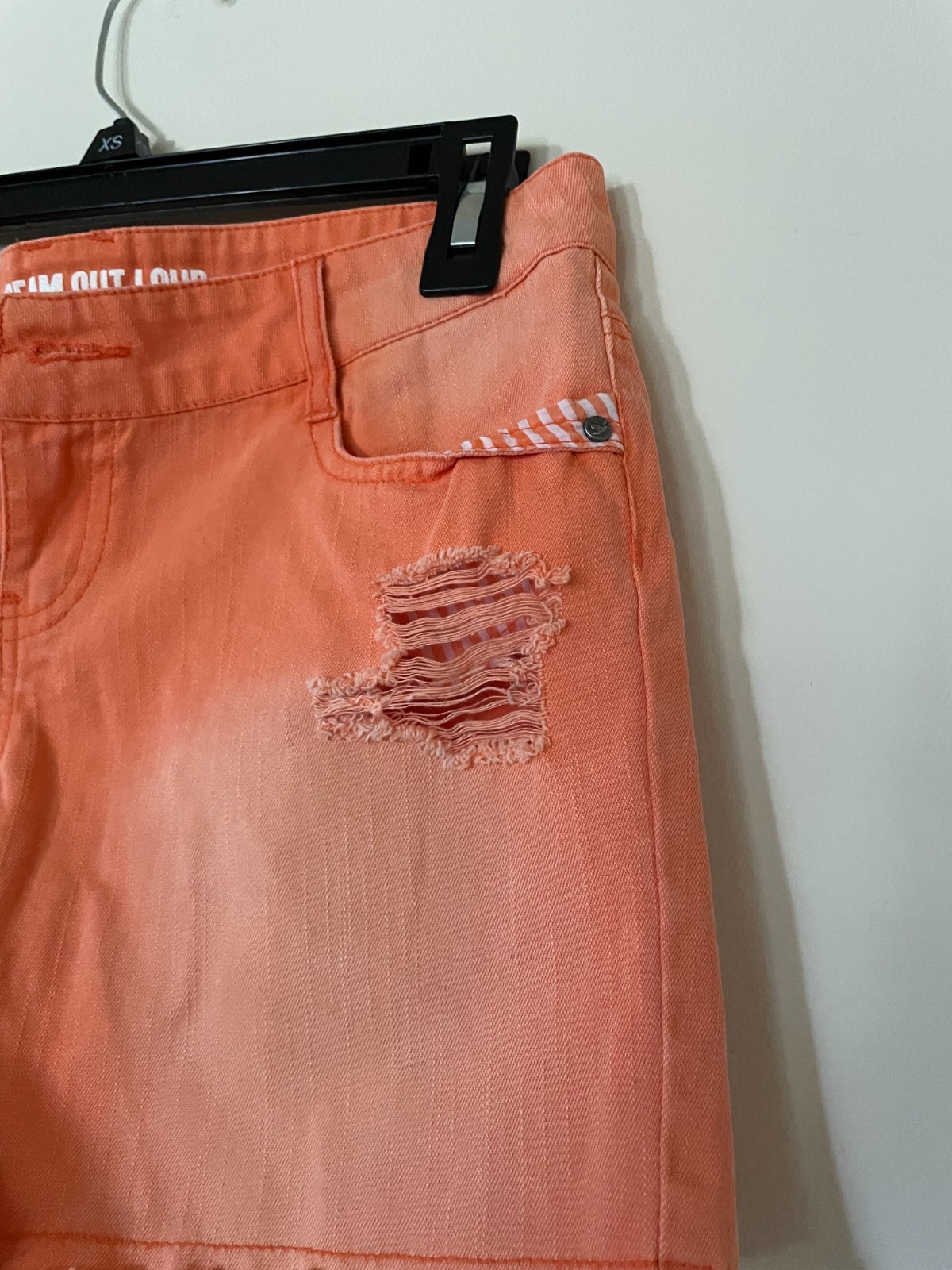 DREAM OUT LOUD distressed orange shorts by Selena Gomez