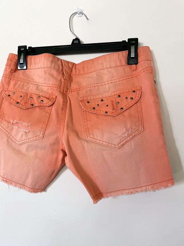DREAM OUT LOUD distressed orange shorts by Selena Gomez