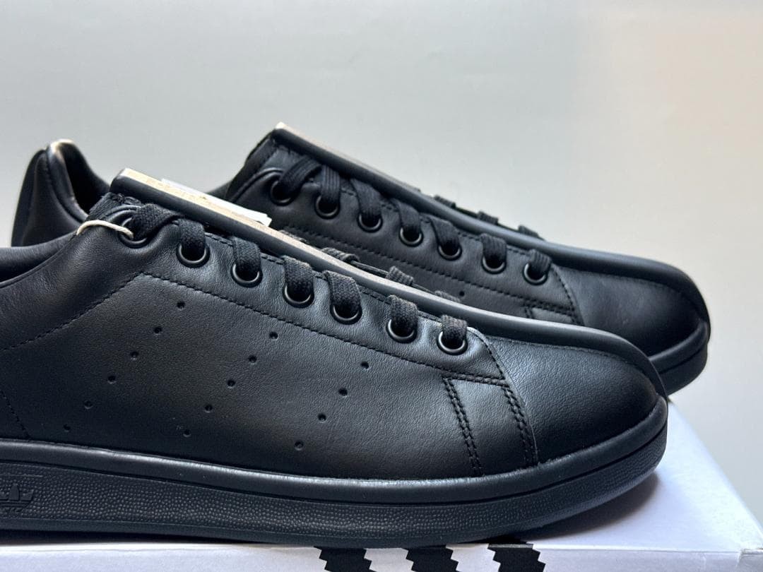 A classic split in half Collaboration Stan Smith black 10