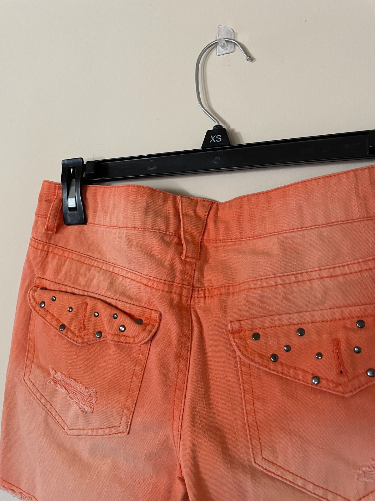 DREAM OUT LOUD distressed orange shorts by Selena Gomez
