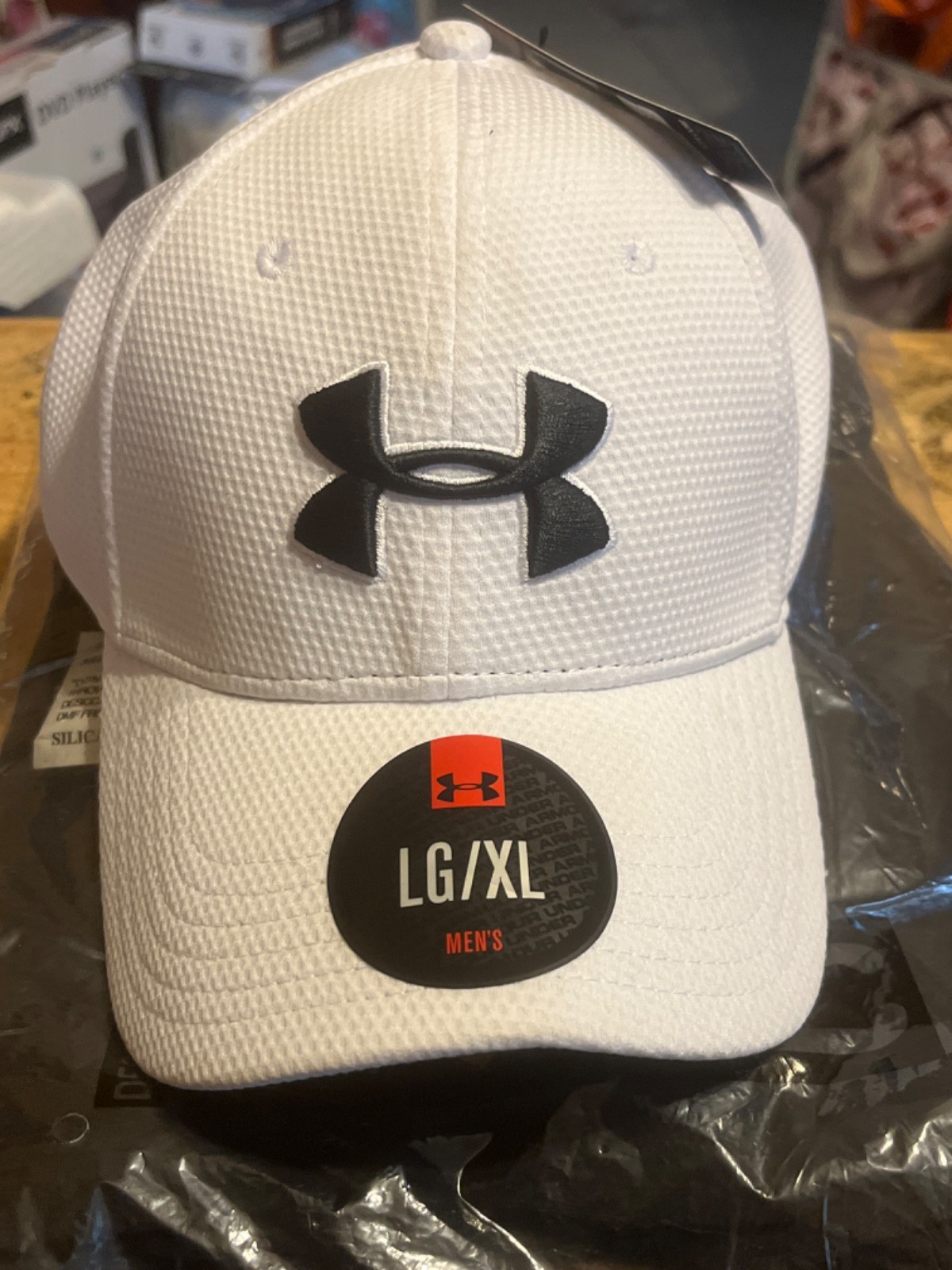 White Under Armour Branded Hat Featuring A Horseshoe Casino Baltimore logo L/XL