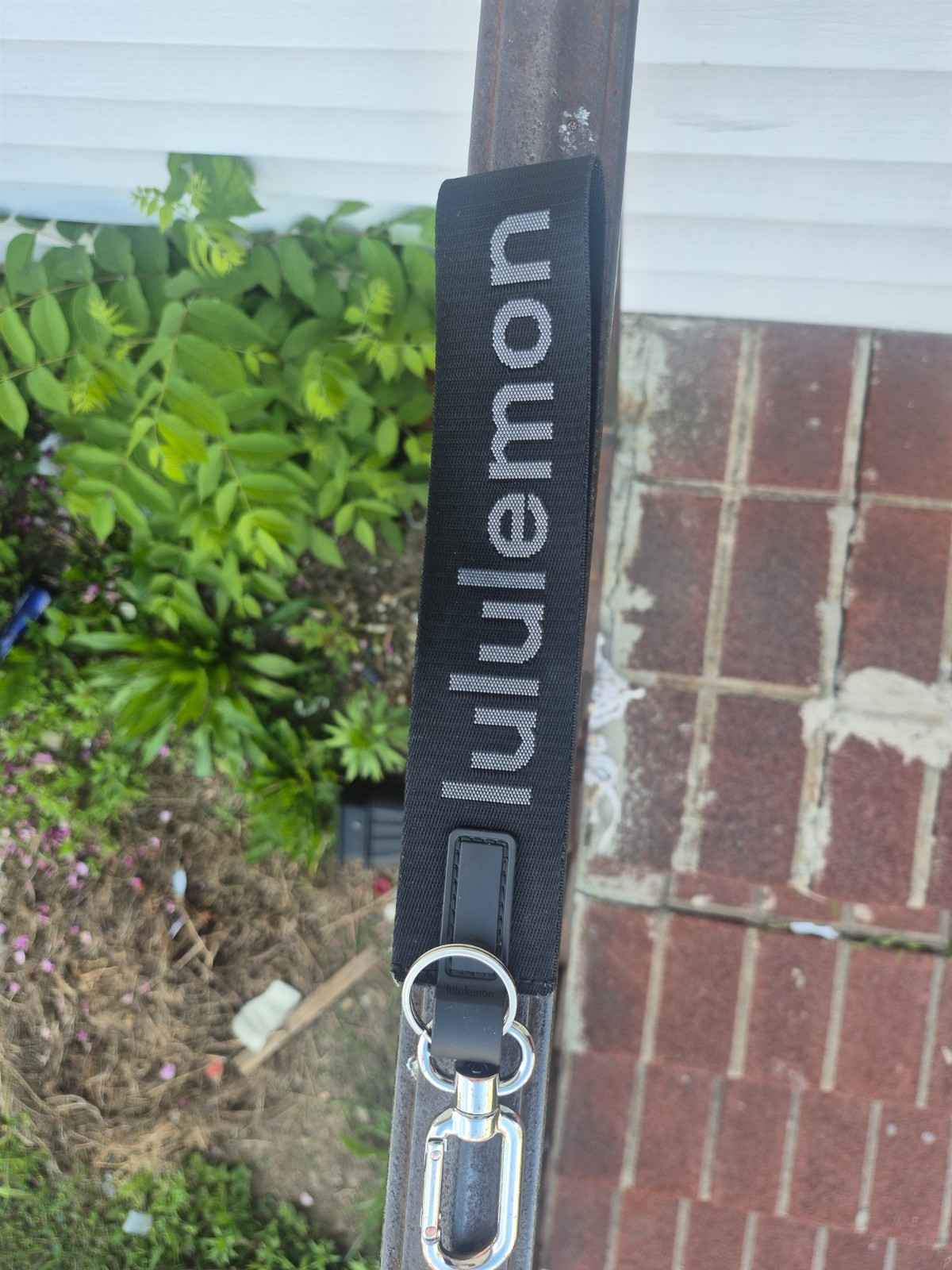 Black lululemon keychain with sliver clasp with Grey letters