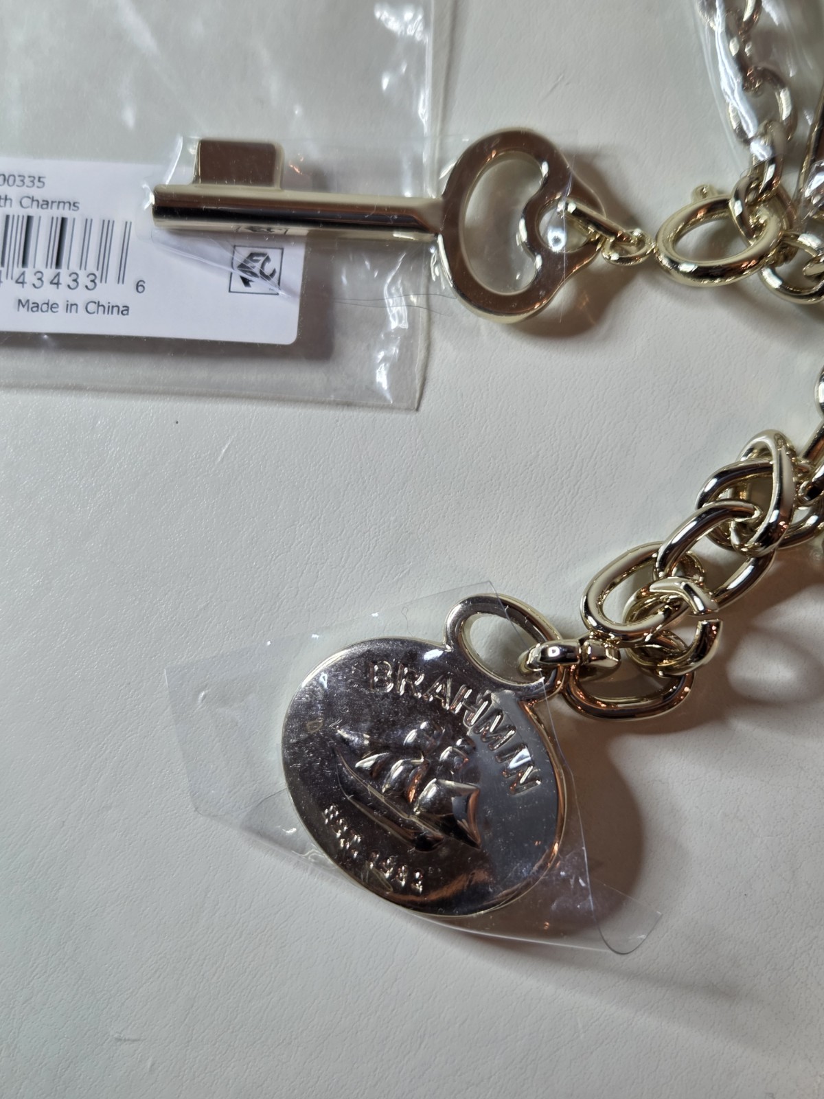 NWT Brahmin Light Gold Lock Clip Charm Key Wagon Logo Accessory Bracelet
